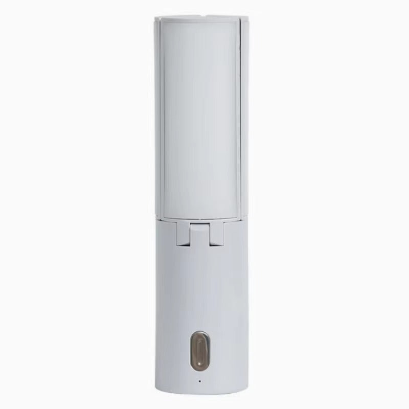 Small cylindrical container with red and black speckles on a white background