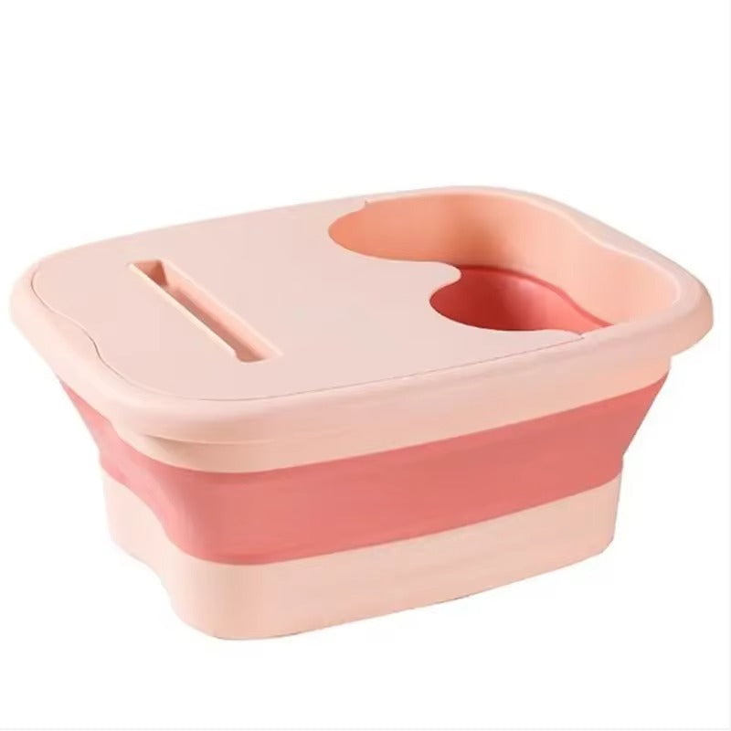 "A blue and white foldable foot bath massage bucket shown in its expanded state, featuring built-in massage rollers at the base and a sturdy carry handle. Ideal for home pedicures and portable foot soaking."