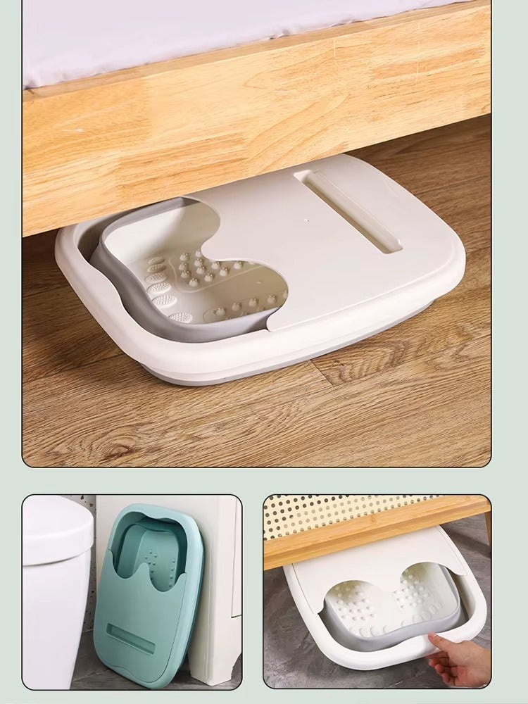 "A blue and white foldable foot bath massage bucket shown in its expanded state, featuring built-in massage rollers at the base and a sturdy carry handle. Ideal for home pedicures and portable foot soaking."