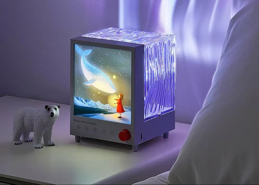 CORECOM® Aurora Box Projector in a minimalist black design sitting on a modern bedside table.