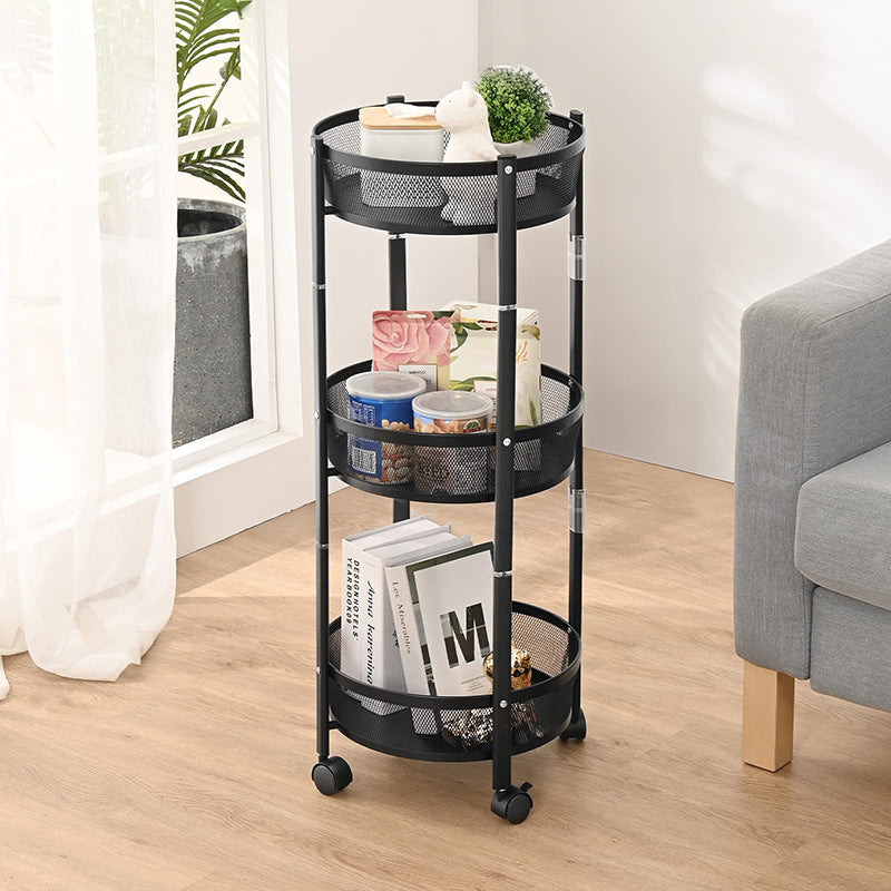 Black CORECOM® multi-layer metal swivel storage rack standing in a modern kitchen.