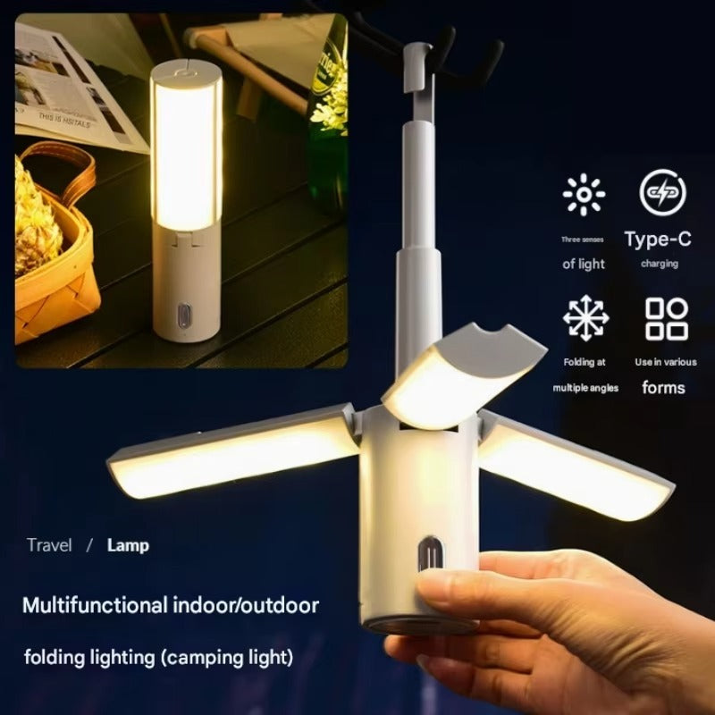 Multifunctional indoor/outdoor folding lighting device held by a hand with features highlighted on a dark background.