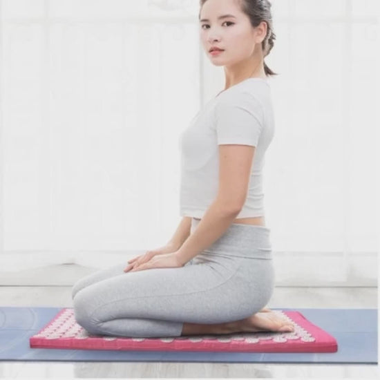 A 30-second wellness video showcasing the CORECOM® Acupressure Mat. The video starts with a close-up of the thousands of pressure spikes, then transitions to a user slowly lying down on the mat. It highlights the focus areas: the lower back, neck, and feet. The video demonstrates the portability of the set and concludes with a calming shot of a user in a deep state of relaxation.
