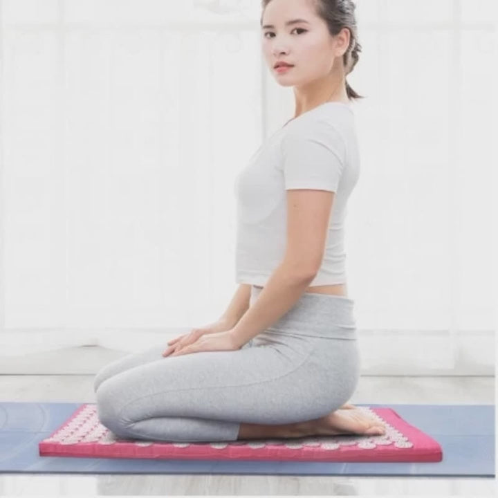 A 30-second wellness video showcasing the CORECOM® Acupressure Mat. The video starts with a close-up of the thousands of pressure spikes, then transitions to a user slowly lying down on the mat. It highlights the focus areas: the lower back, neck, and feet. The video demonstrates the portability of the set and concludes with a calming shot of a user in a deep state of relaxation.